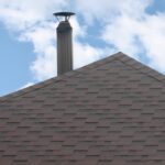 The roof covered with a modern flat bituminous waterproof coating under a blue sky